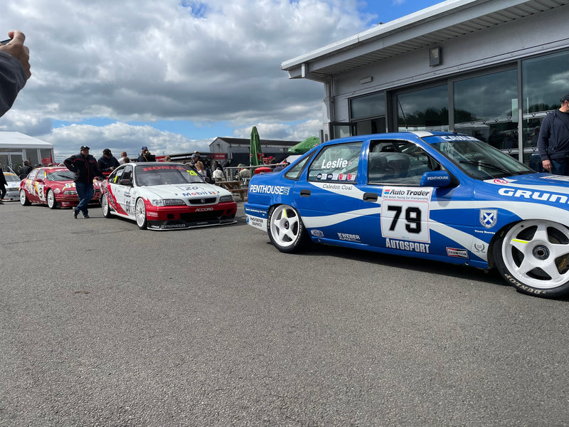 Super Grand Touring Cars leaving the paddock