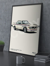 Load image into Gallery viewer, Framed poster of a classic car on a gray surface with a mug and books.