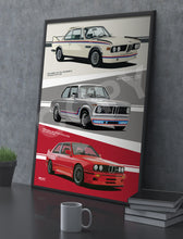 Load image into Gallery viewer, Framed poster of BMW cars on a gray surface with a mug and books.